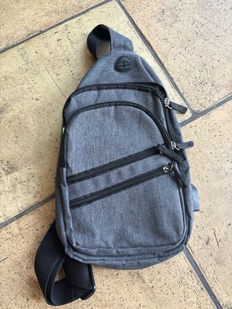 Stylish grey crossbody bag with USB port, perfect for summer