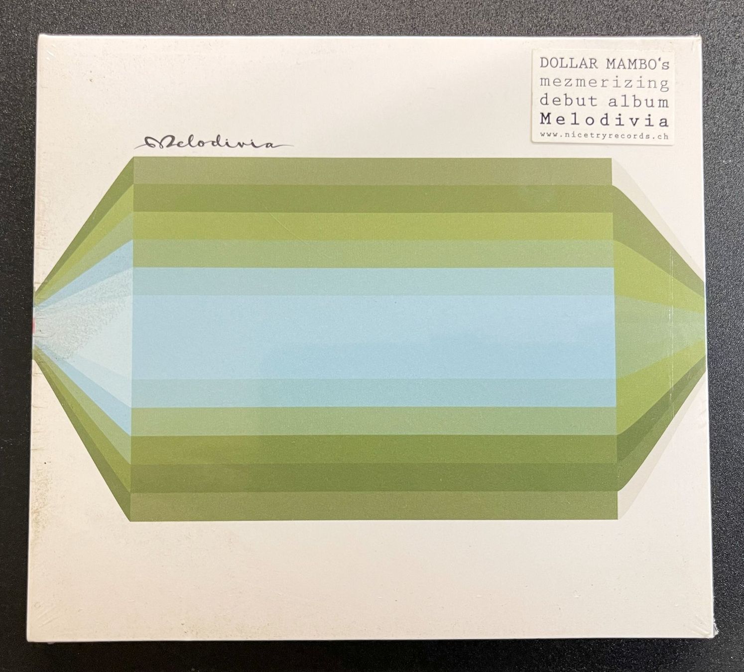 CDs: Melodivia / Dollar Mambo - CD – Neu und originalverpackt aus Oftringen von Vucki