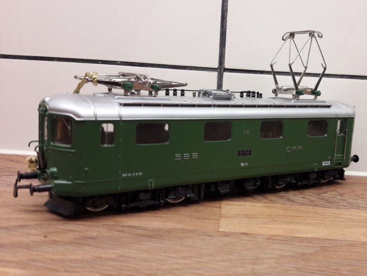 HAG 088 HO. locomotive CFF Re 4/4, 75 ans du SEV, avec boite (Neuf avec emballage d'origine) à