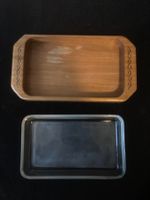Kleines Plättchen aus Holz mit einem