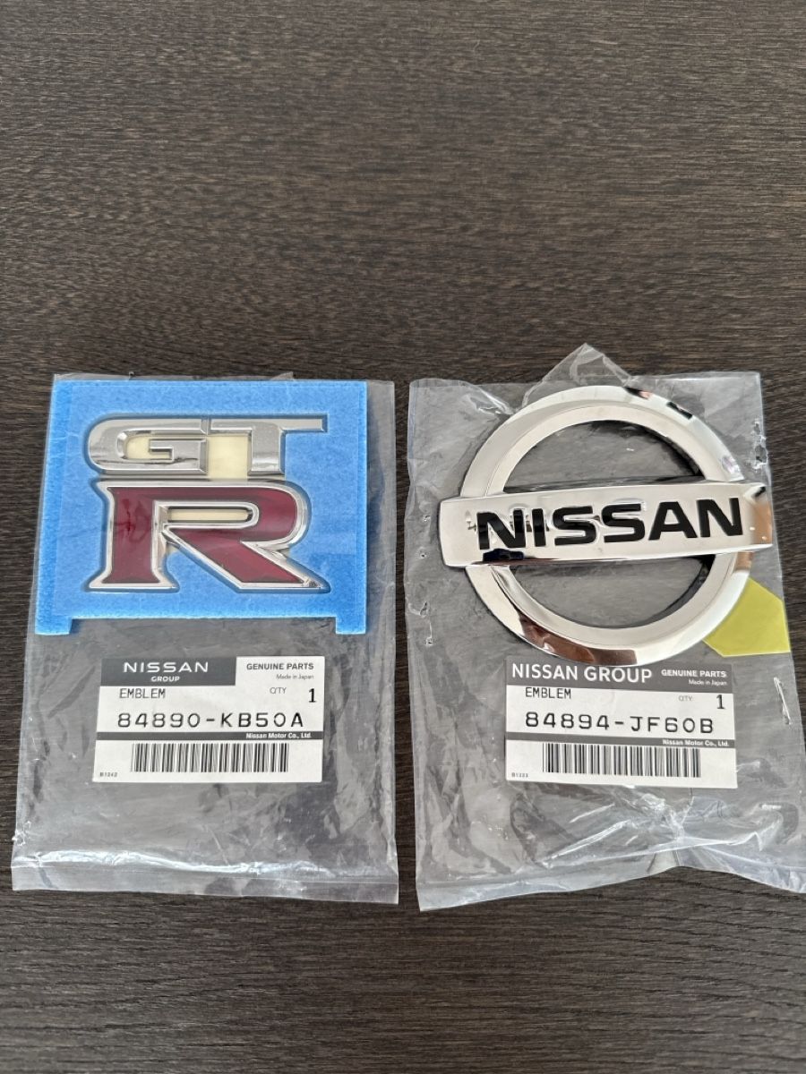 Nissan Tutti pezzi di ricambio auto: Nissan GTR Logos Heck – Nuovo e nell'imballaggio originale da Zürich venduto da TOPG93