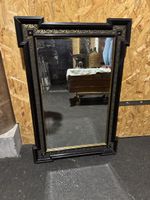 Miroir ancien avec cadre noir et or, parfait pour décorer