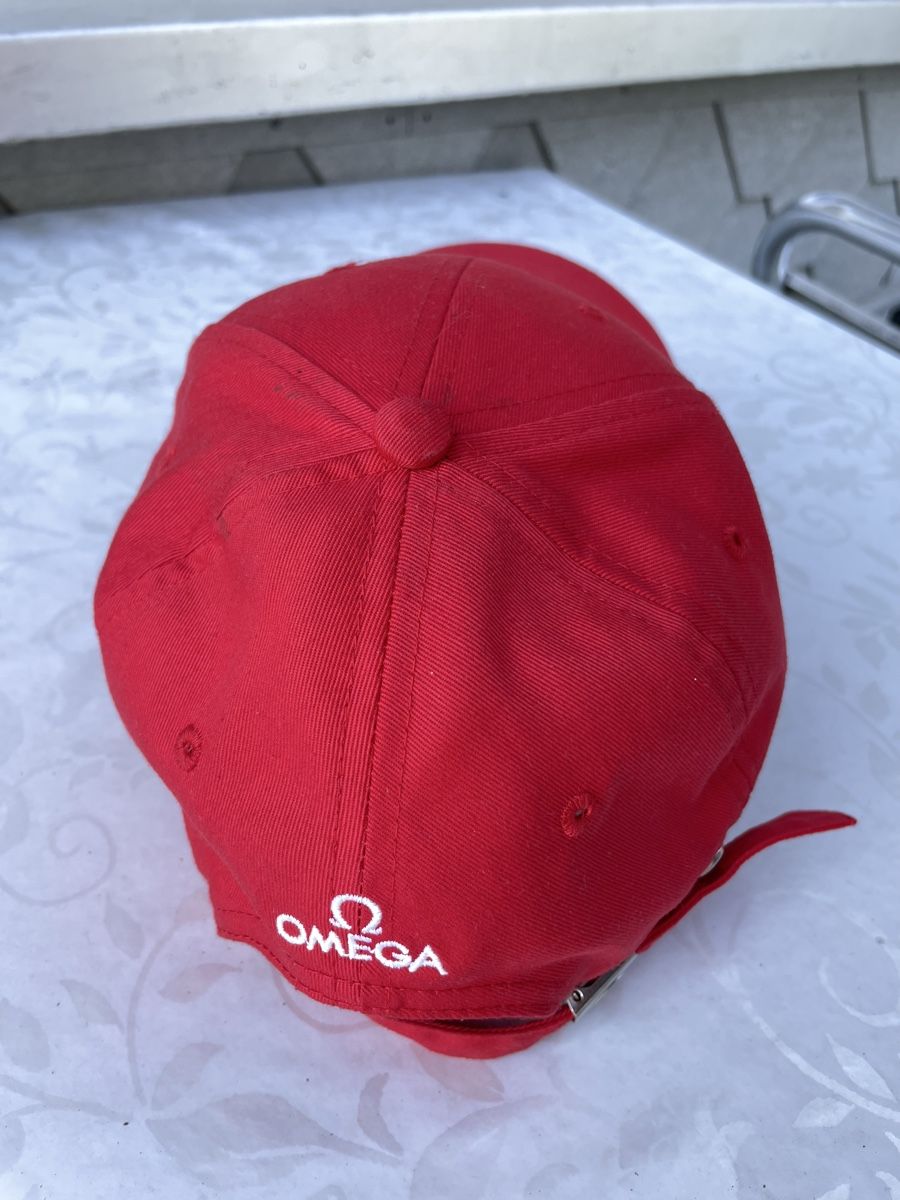 Copricapi, berretti & cappellini: Casquette Oméga rouge – Usato da Biel/Bienne venduto da Galaq 2