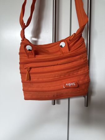 Orange Umhängetasche mit Augen