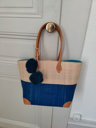 Straw teal raffia lined bag with pompoms leather handles