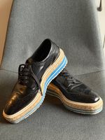 Chaussures Derby compensées Prada Wingtip en cuir