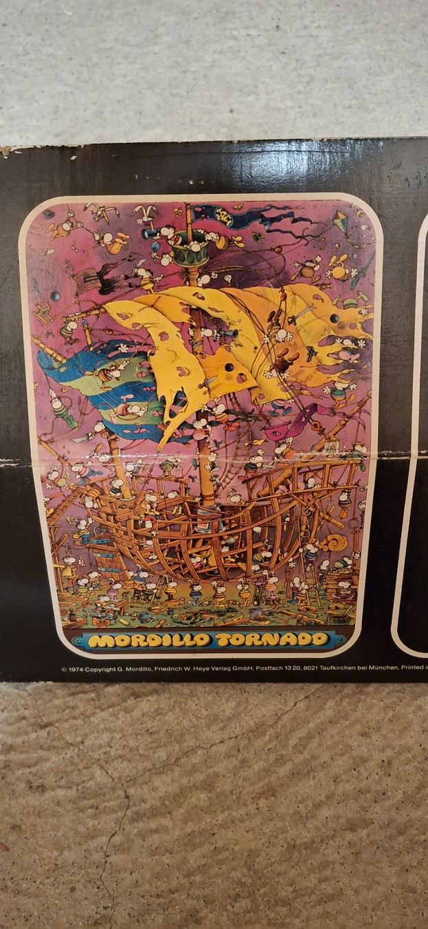 Heye Puzzle: 1970s Puzzle Heye 1500 pièces : Mordillo : Tornado – Usato da Meyrin venduto da lay_6z6q 1