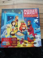 Puzzle und Buch die Weihnachtsgeschichte