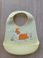 Gelbes Silikon-Lätzli mit Corgi-Motiv, guter Zustand!