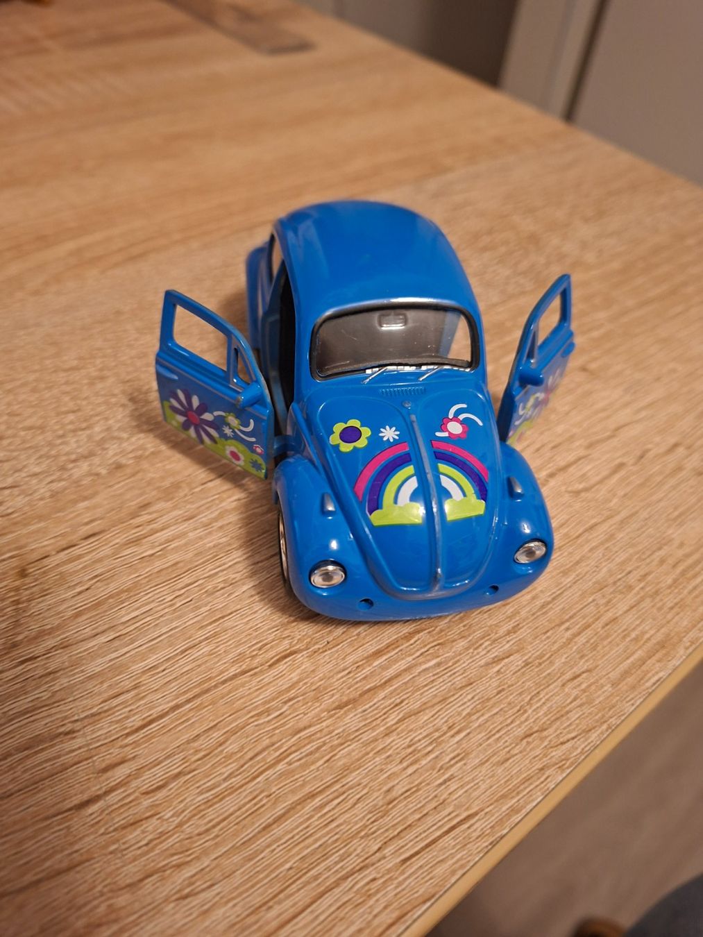 Volkswagen Modellini d'auto: VW Käfer Modellauto blau mit Blumenmuster – Usato da Ehrendingen venduto da CHMEX 1