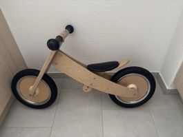 Laufrad aus Holz für Kinder in gebrauchtem Zustand