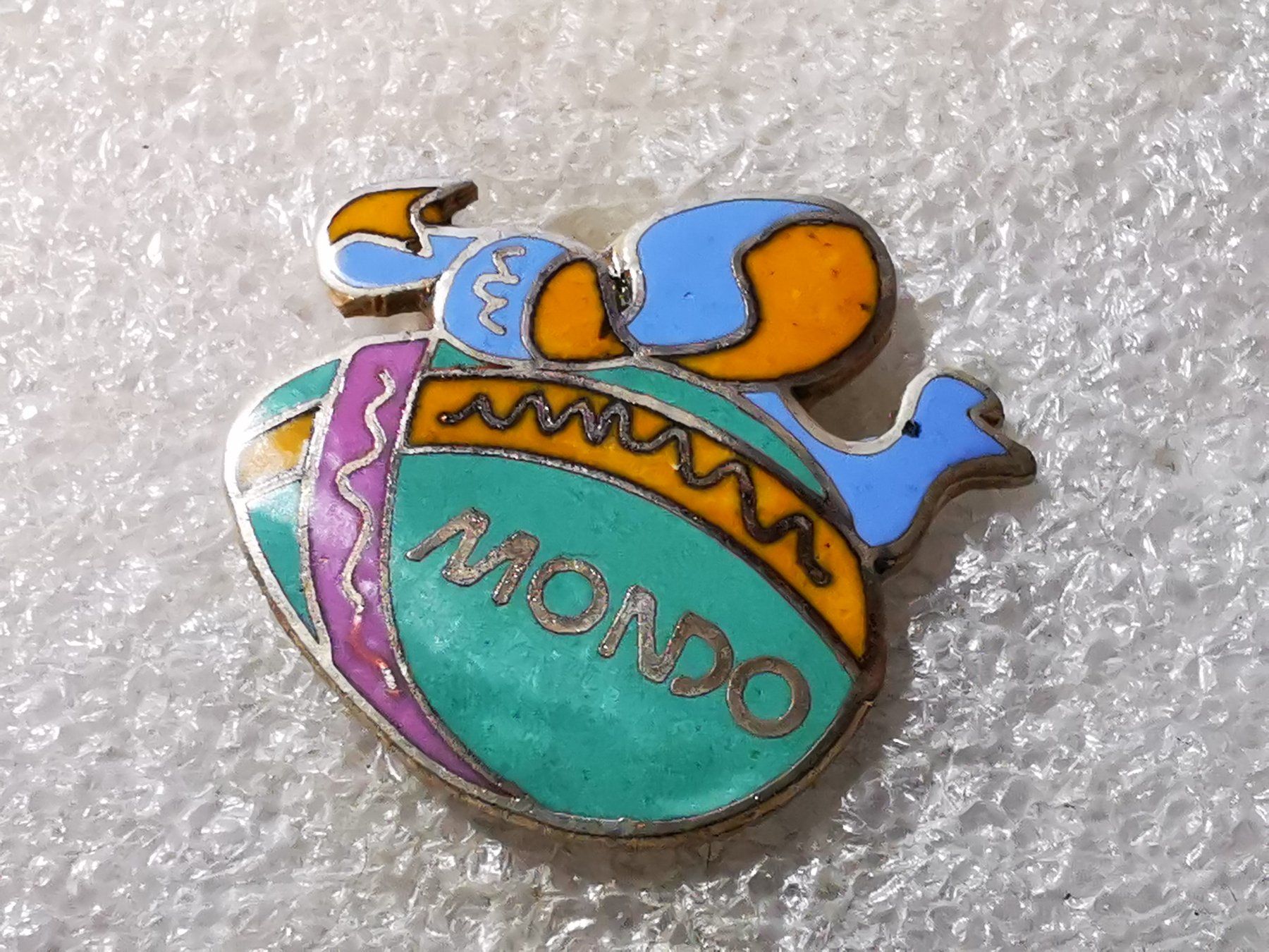 Placchette & Badge: Ansteckpin 49: Mondo – Usato da Oppligen venduto da Pin-Fall-Shop