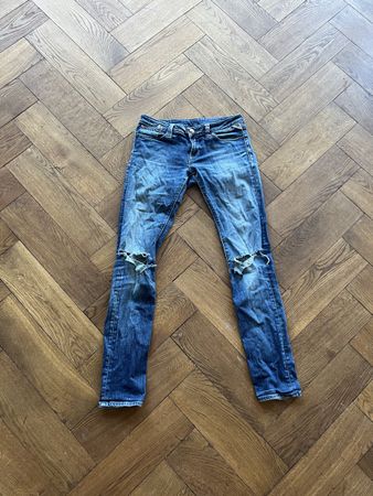 Jeans Replay  avec trous aux genoux état usagé W27 L34