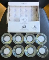 50 white tealight candles with 6 thick glass holders