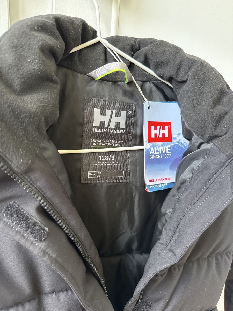 Helly Hansen Cappotti: Doudoune Helly Hansen noire, taille 128, comme neuve! – Usato da Puidoux venduto da serendipite 1