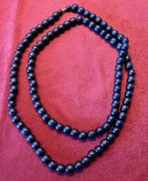 Sautoir de perles en bois foncé, look élégant et sobre!