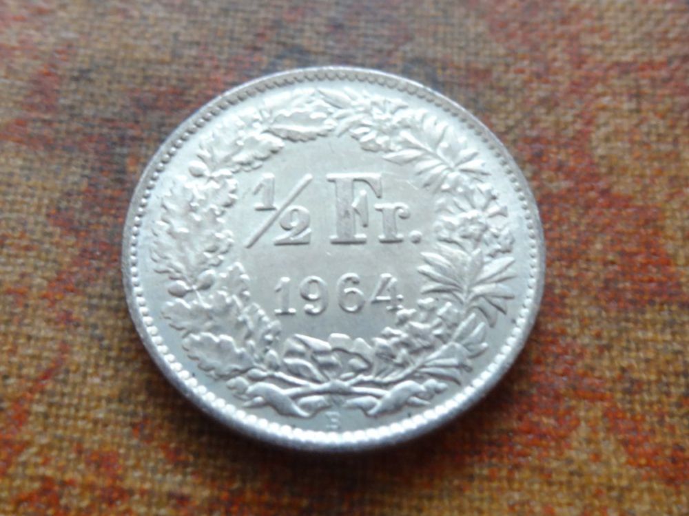Tutti le monete: 1/2 Fr. 1964 – Usato da Romanel-sur-Lausanne venduto da Swift13