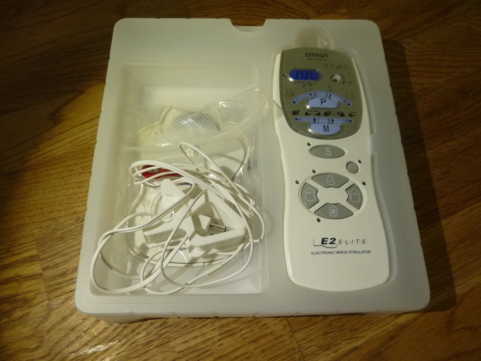Omron Dispositivi per massaggi: Omron E2 Elite TENS-Massagegerät 149 neuwertig – Usato da Hochfelden venduto da swissice 1