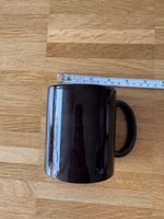 Tasse noire avec révélation chaleur