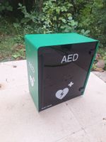 AED-Schrank DefiSign grün/schwarz guter Zustan