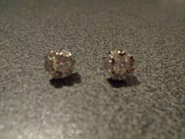 Ohrstecker silberfarbig, rund/weisse Steinchen
