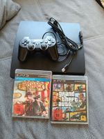 PlayStation 3 Konsole mit Controller und zwei Spielen