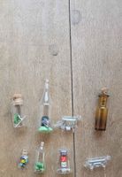 Dekoration Miniaturfiguren in Flaschen 