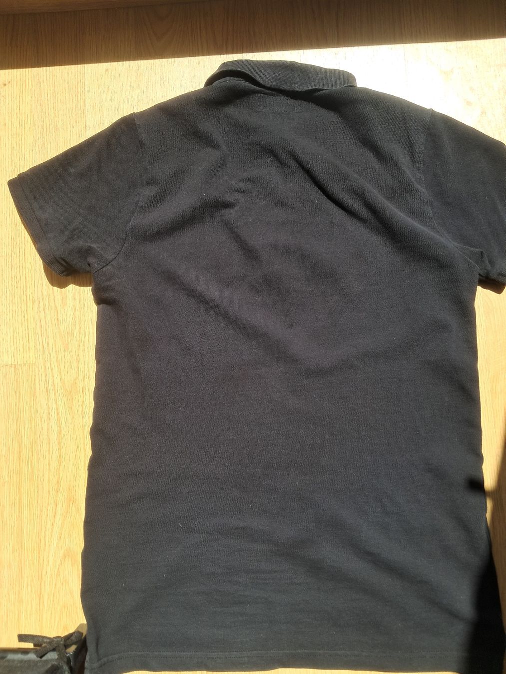 Next Chemises, T-shirts & Polos: Polohemd Next.82 schwarz  – D'occasion à Biel/Bienne par sof_yx5y 1