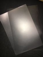 Zwei durchsichtige (Tisch-) Sets CHF 0,50