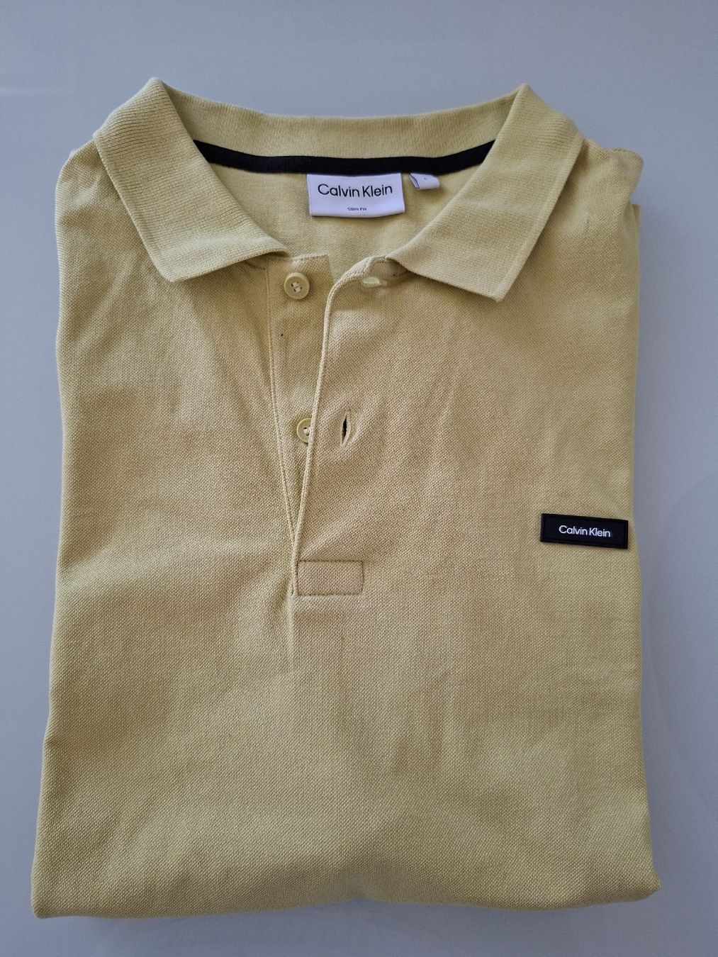 Calvin Klein Magliette Polo: Polo Calvin Klein Jaune Moutarde Taille  – Usato da Renens VD venduto da ser_j2fn