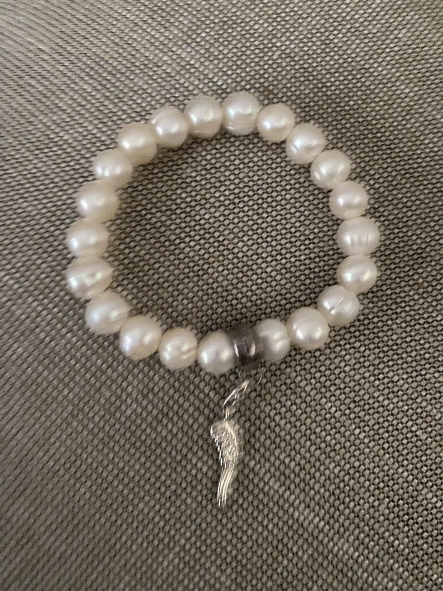 Bracciali & Braccialetti: Thomas Sabo Perlarmband mit Engelsflügel Charm – Usato da Muri AG venduto da sonneblueme10