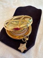Estée Lauder Puder Dose mit Sternanhänger, goldfarben
