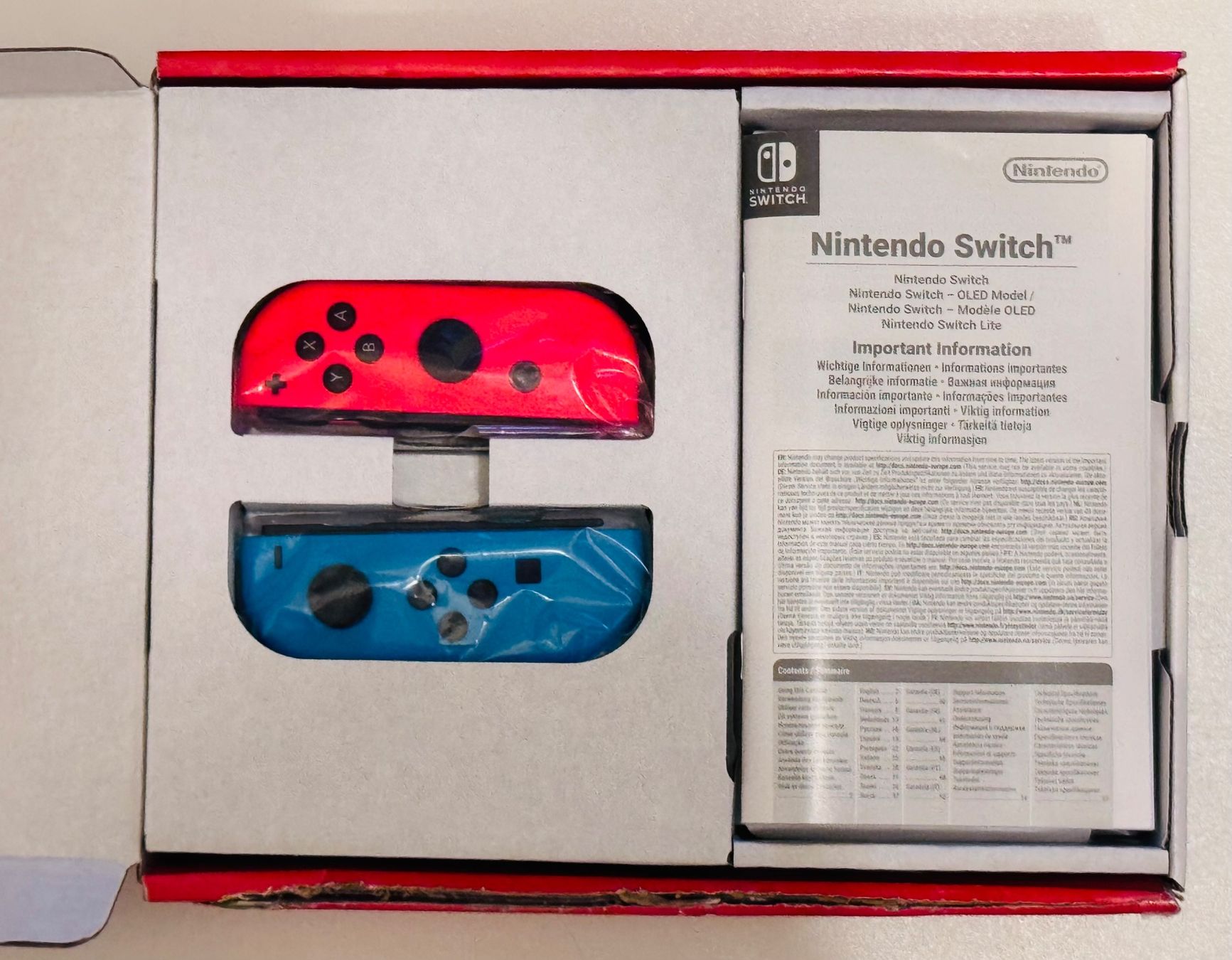 Nintendo Console: Nintendo Swicth Console, rouge néon/bleu néon – Nuovo e nell'imballaggio originale da Genève venduto da Murmurs 2