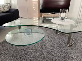 Moderner Couchtisch aus Glas mit drehbarer Ebene