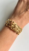 Bracciale Trifari rigido color oro con volute vintage