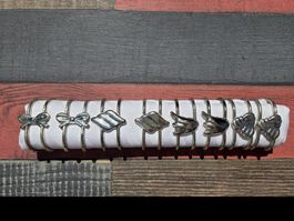 8x Vintage Serviettenringe (versilbert) – 4 Motive (je 2)