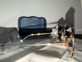 Lunettes de soleil femme Gucci monture or verres dégradés ne