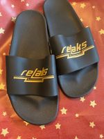 Profilierte Badeschuhe RELAKS, schwarz/gold, Gr. 39