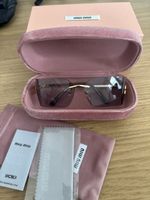 Occhiali da sole Miu Miu donna grigio-rosa con custodia