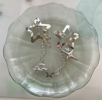 Barrettes étoiles argentées avec chaînettes et étoiles