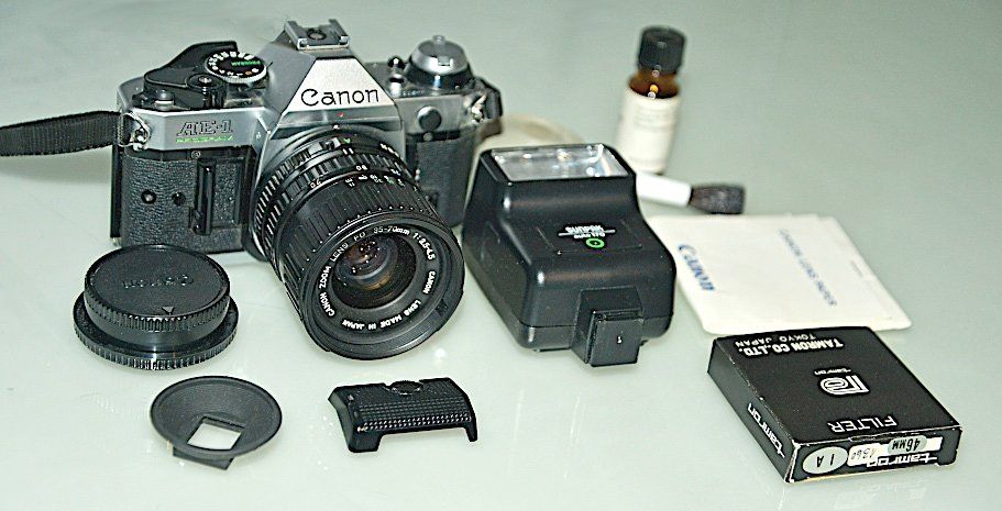 Canon Kamera: Analoge Canon AE-1 Program Spiegelreflexkamera mit Blitz – Gebraucht aus Winterthur von Meiermueller