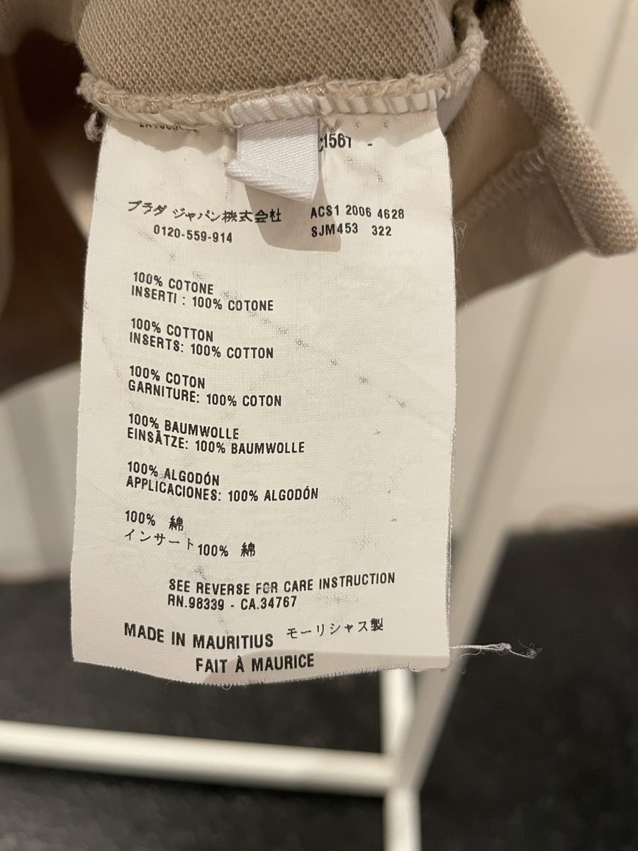 Prada Magliette Polo: Prada Polo-Shirt Beige – Usato da Windisch venduto da rascale 4