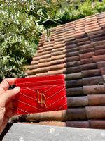 Vendo portacarte color rosso corallo /anguria