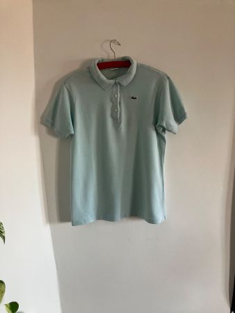 Polo Lacoste turquoise femme taille 34 trou bas