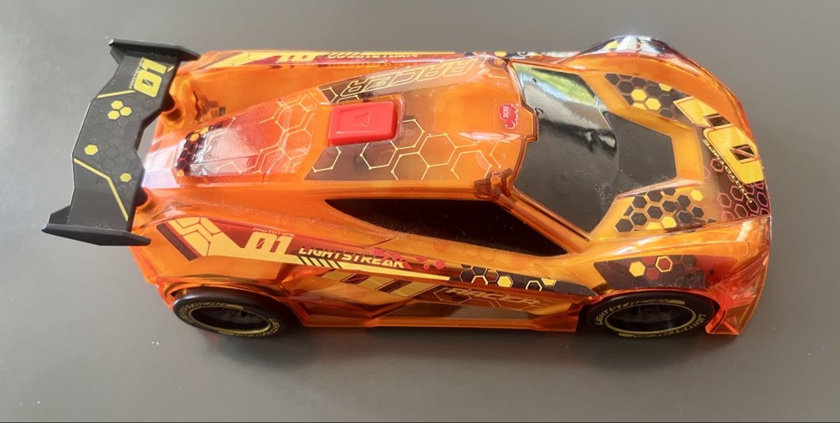Jouets: Spielzeugauto orange – D'occasion à Uster par SAM0406