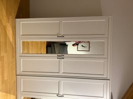 Two white wardrobes