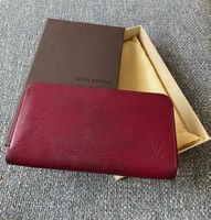 Portefeuille Louis Vuitton Epi fuchsia, zippé en bon éta