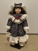 Poupée porcelaine
