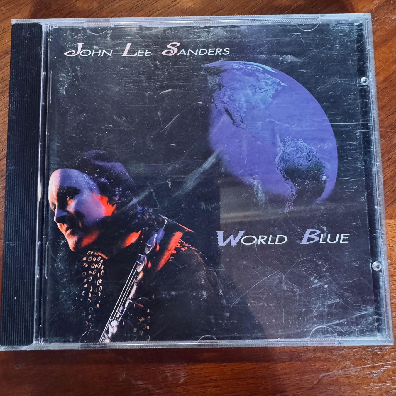 CD: John Lee Sanders World Blue CD – Usato da Merligen venduto da barratt