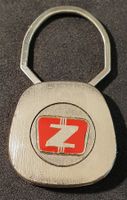 GG104 - Alter Schlüsselanhänger Auto Logo Zastava Serbien